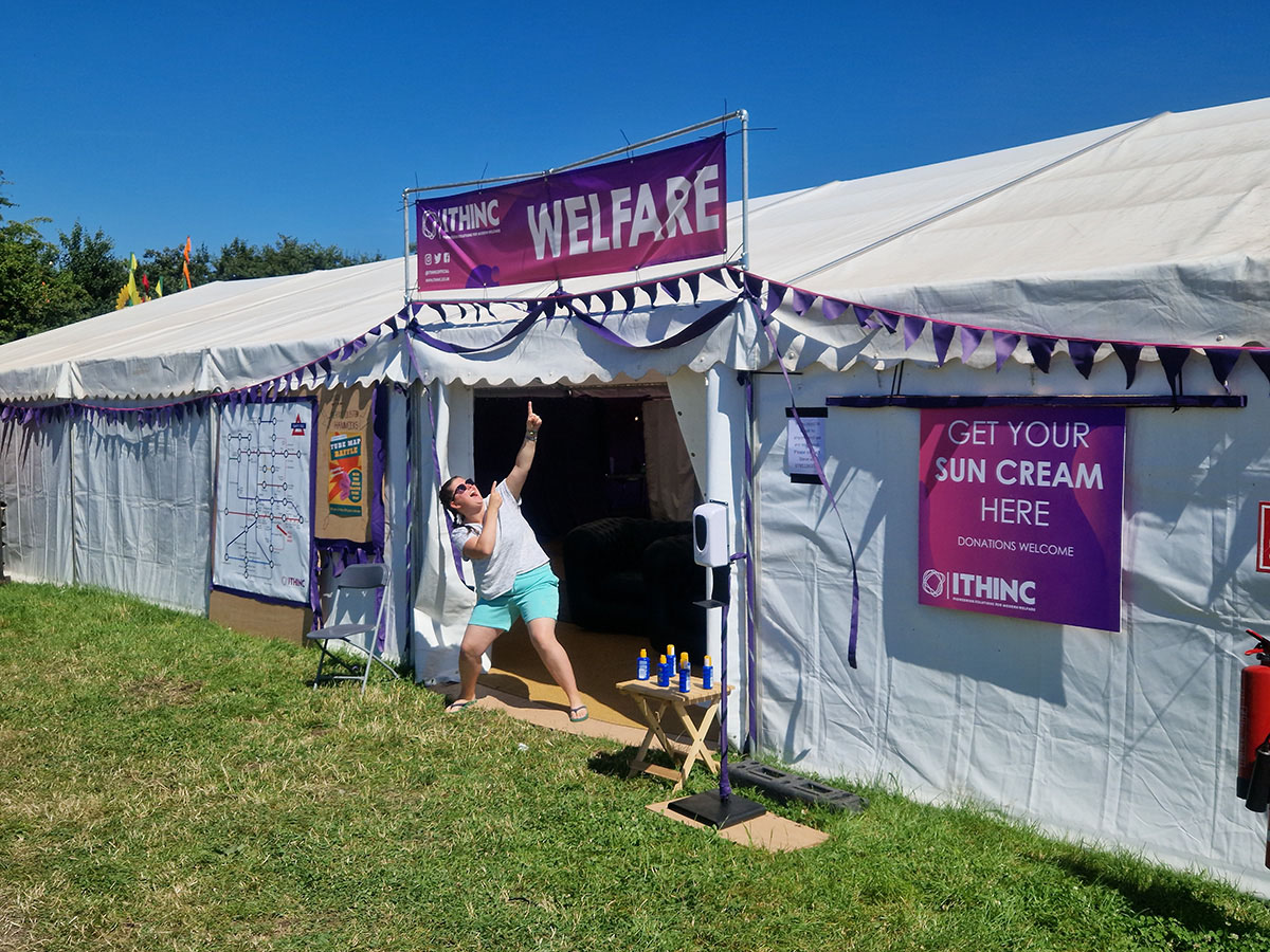 The welfare services tent being highlighted by one of the festival volunteers